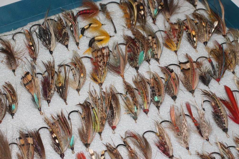 A collection of antique salmon flies in traditional patterns