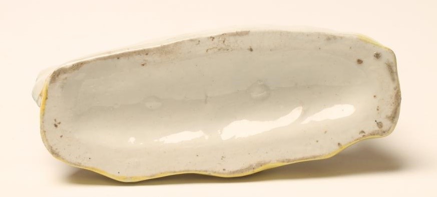 A VICTORIAN STAFFORDSHIRE POTTERY GREYHOUND Image