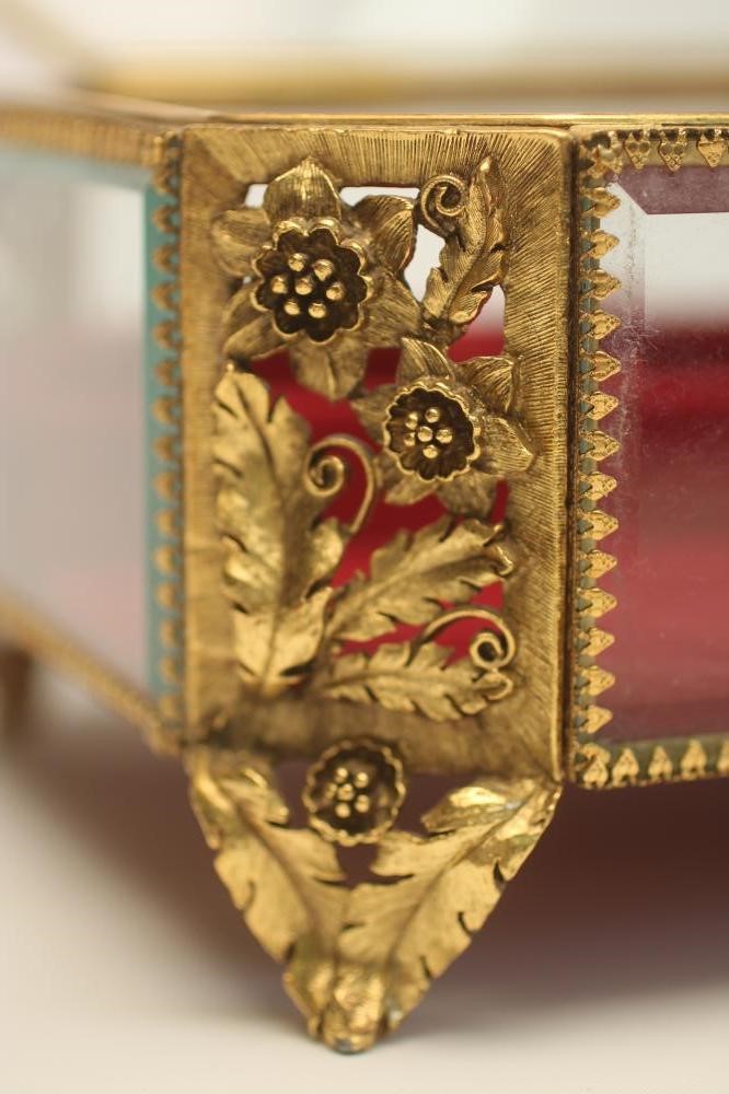 A GLASS AND GILT METAL JEWELLERY CASKET Image