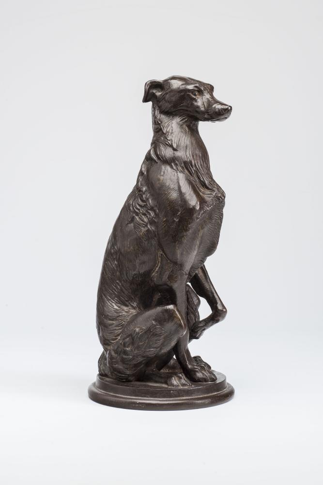 A COALBROOKDALE STYLE CAST IRON FIGURE OF A DEER HOUND in a bronzed finish Image