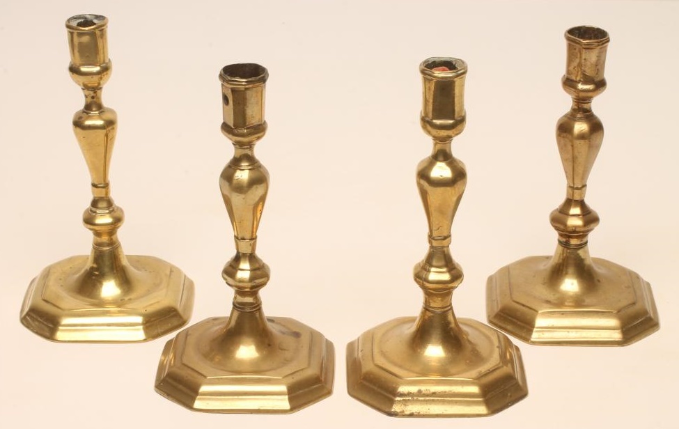 FOUR GEORGIAN BRASS CANDLESTICKS Image