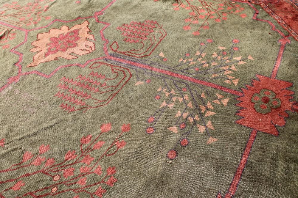 A DONEGAL STYLE ARTS & CRAFTS WOOL CARPET Image