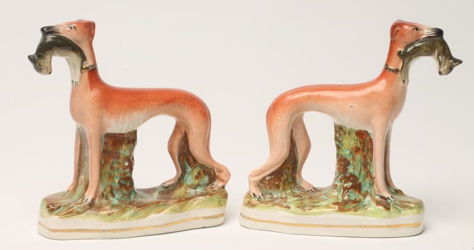 A PAIR OF VICTORIAN STAFFORDSHIRE POTTERY GREYHOUNDS Image