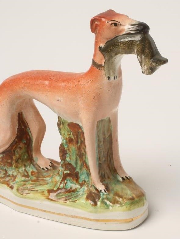 A PAIR OF VICTORIAN STAFFORDSHIRE POTTERY GREYHOUNDS Image