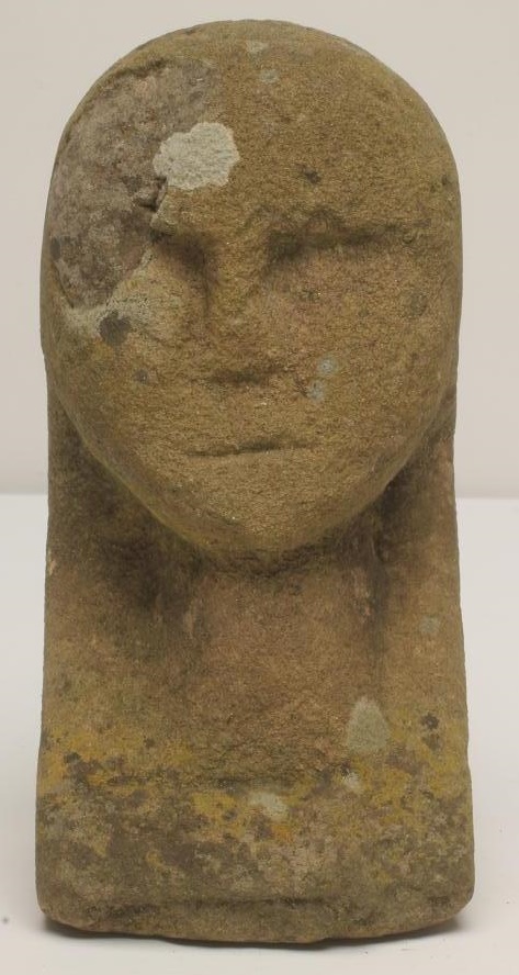 A CARVED SANDSTONE HUMAN HEAD Image