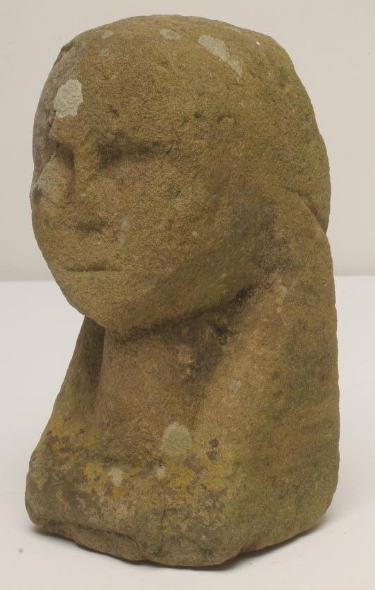 A CARVED SANDSTONE HUMAN HEAD Image