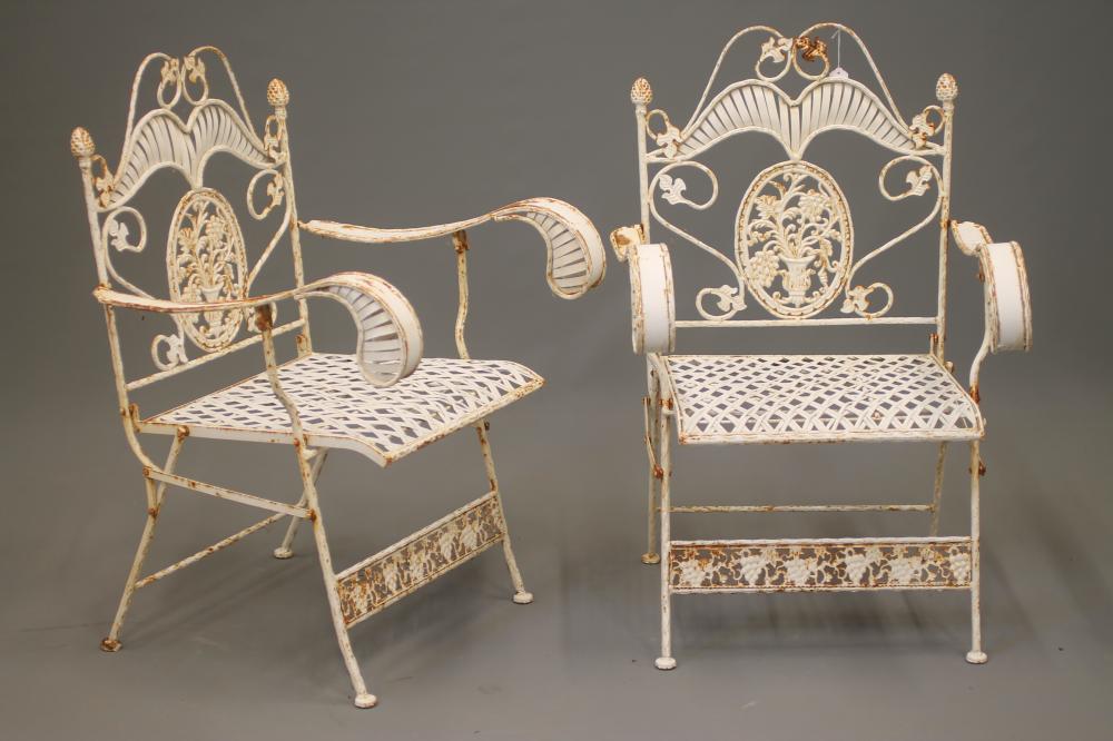 A PAIR OF FOLDING CAST IRON GARDEN ARMCHAIRS Image