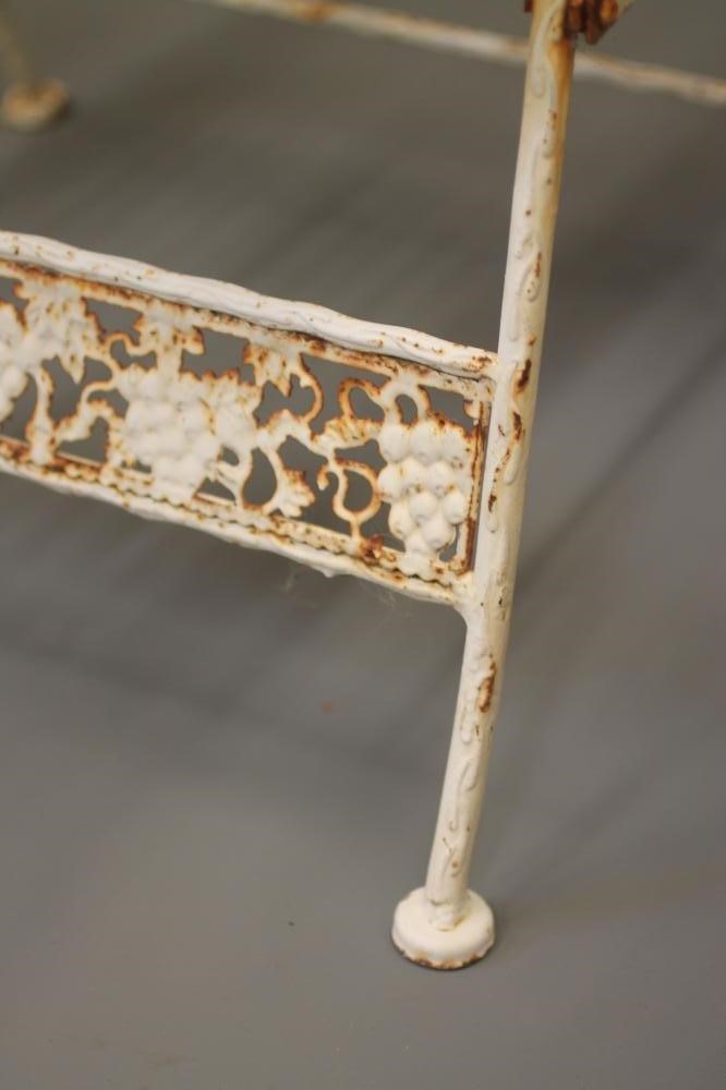 A PAIR OF FOLDING CAST IRON GARDEN ARMCHAIRS Image