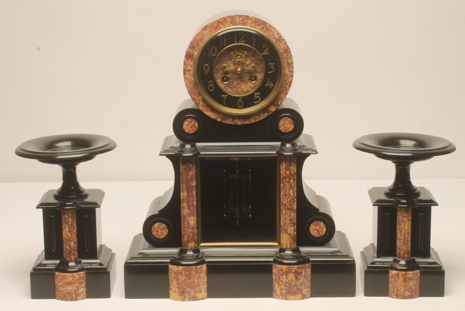 A FRENCH BLACK SLATE AND ROUGE MARBLE CLOCK GARNITURE by Samuel Marti Image