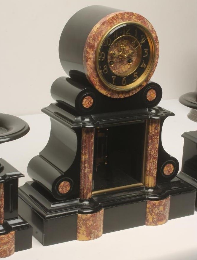 A FRENCH BLACK SLATE AND ROUGE MARBLE CLOCK GARNITURE by Samuel Marti Image