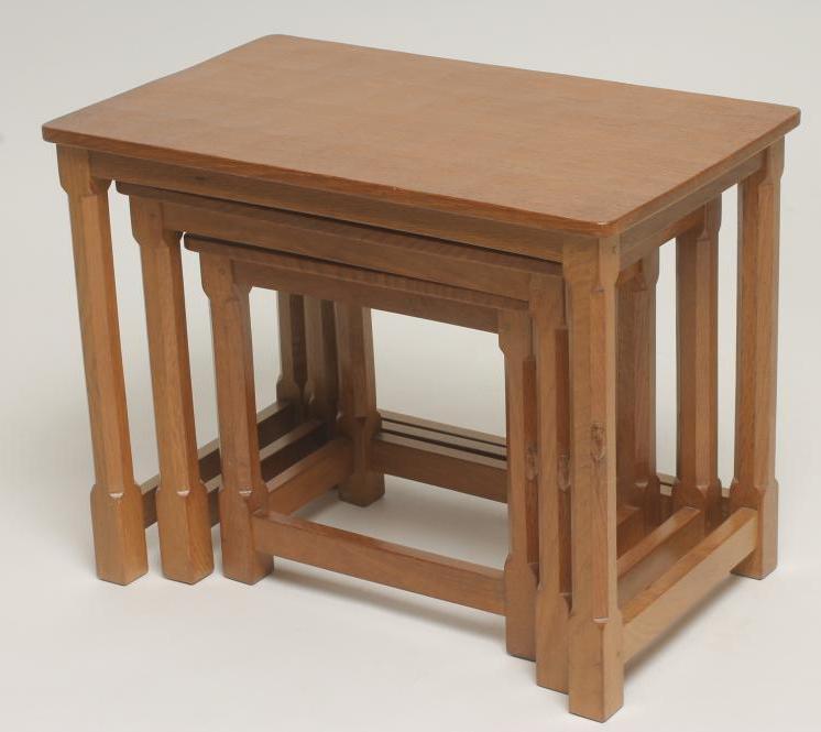 A NEST OF THREE ADZED OAK TABLES by Robert Thompson Image