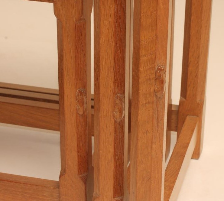 A NEST OF THREE ADZED OAK TABLES by Robert Thompson Image