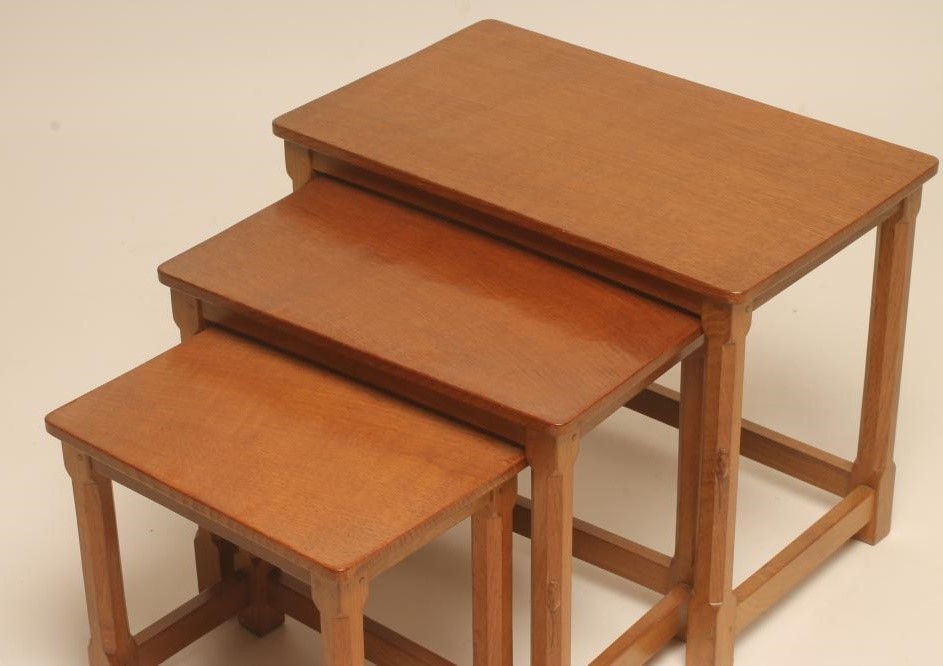 A NEST OF THREE ADZED OAK TABLES by Robert Thompson Image