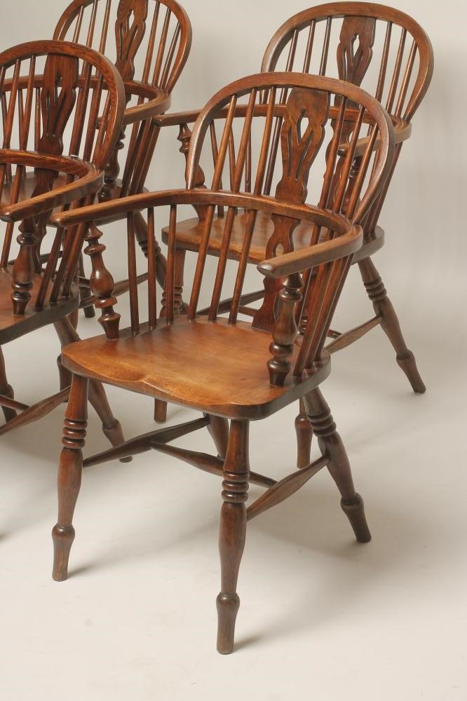 A SET OF FOUR ASH AND ELM WINDSOR ARMCHAIRS Image