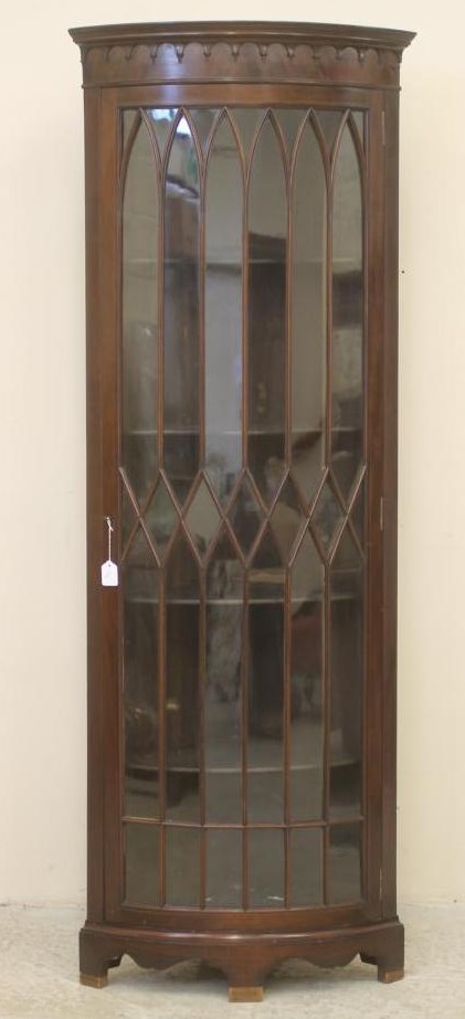 A MAHOGANY STANDING CORNER CUPBOARD Image