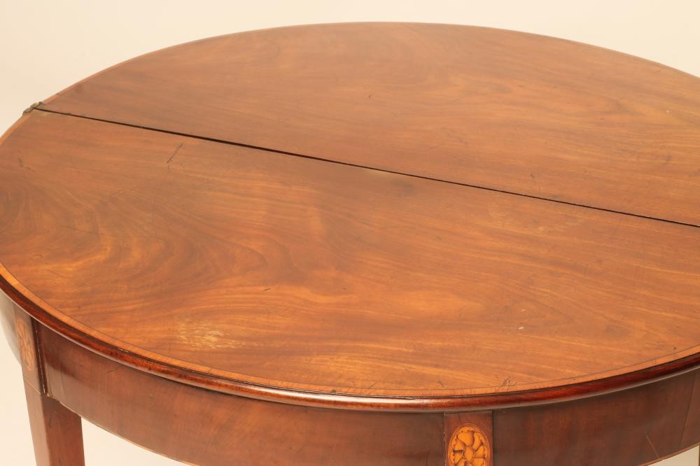 A GEORGIAN MAHOGANY FOLDING TEA TABLE Image