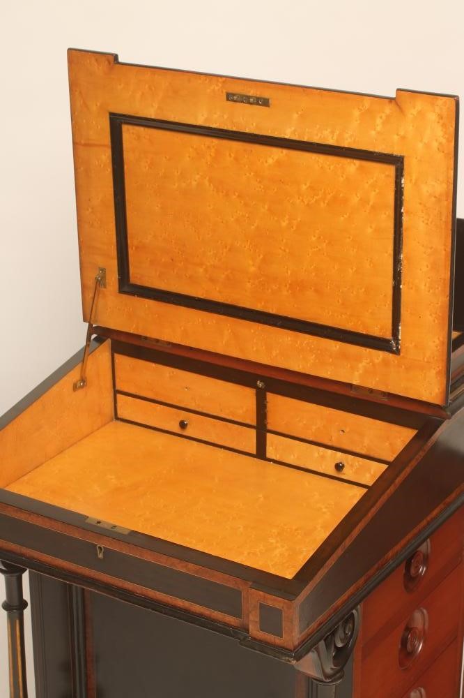 A VICTORIAN EBONISED AND PARCEL GILT DAVENPORT with stringing and amboyna banding Image