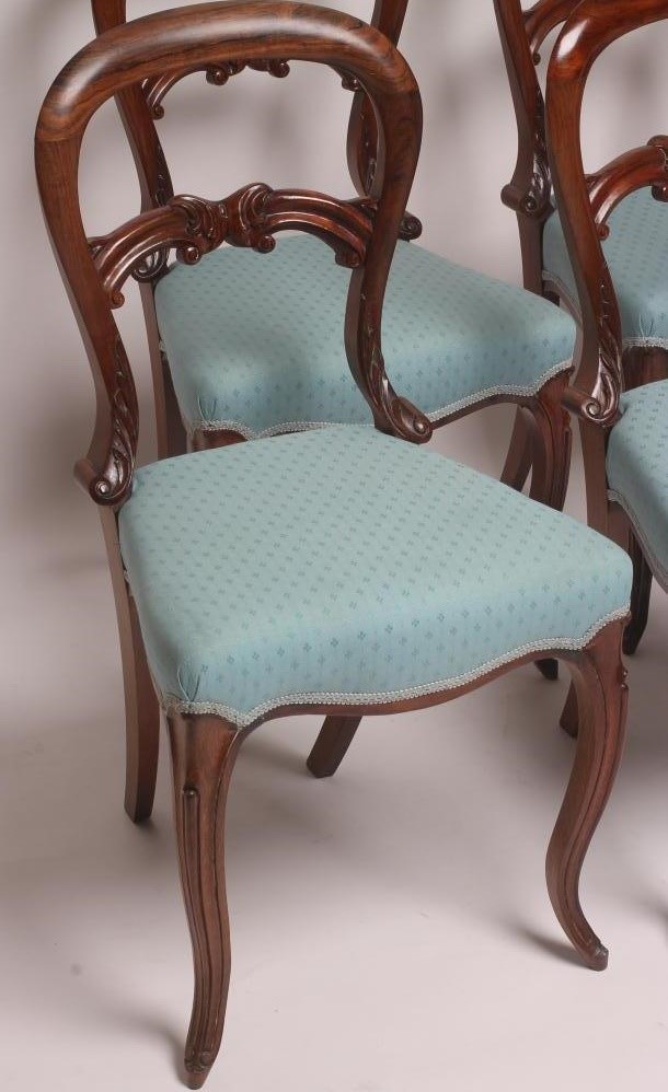 A SET OF SIX VICTORIAN ROSEWOOD DINING CHAIRS of balloon back form upholstered in turquoise weave Image