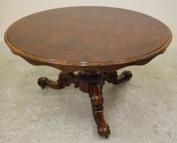 A VICTORIAN WALNUT BREAKFAST TABLE Image