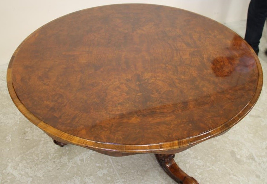 A VICTORIAN WALNUT BREAKFAST TABLE Image