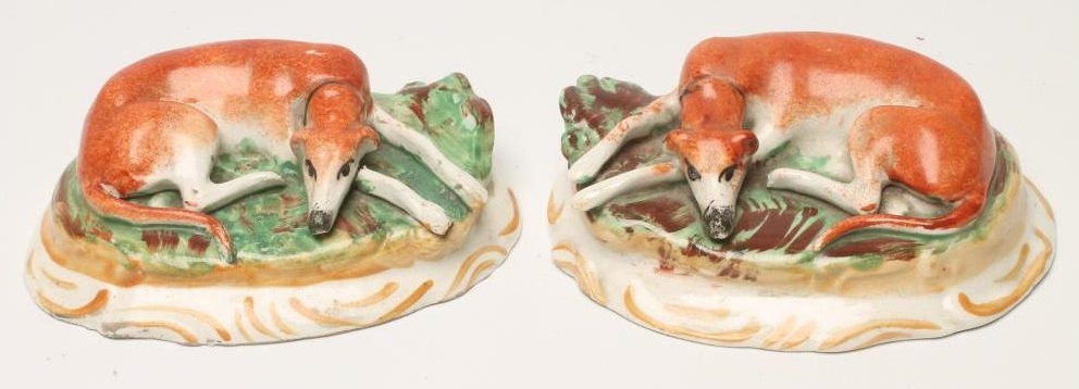 A PAIR OF VICTORIAN STAFFORDSHIRE POTTERY GREYHOUNDS Image