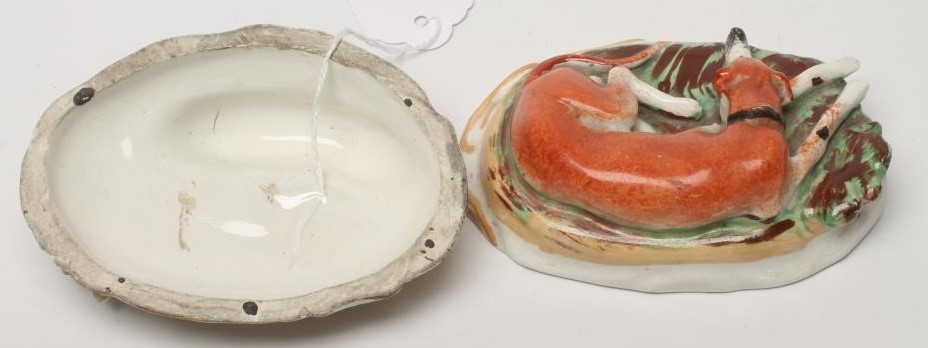 A PAIR OF VICTORIAN STAFFORDSHIRE POTTERY GREYHOUNDS Image