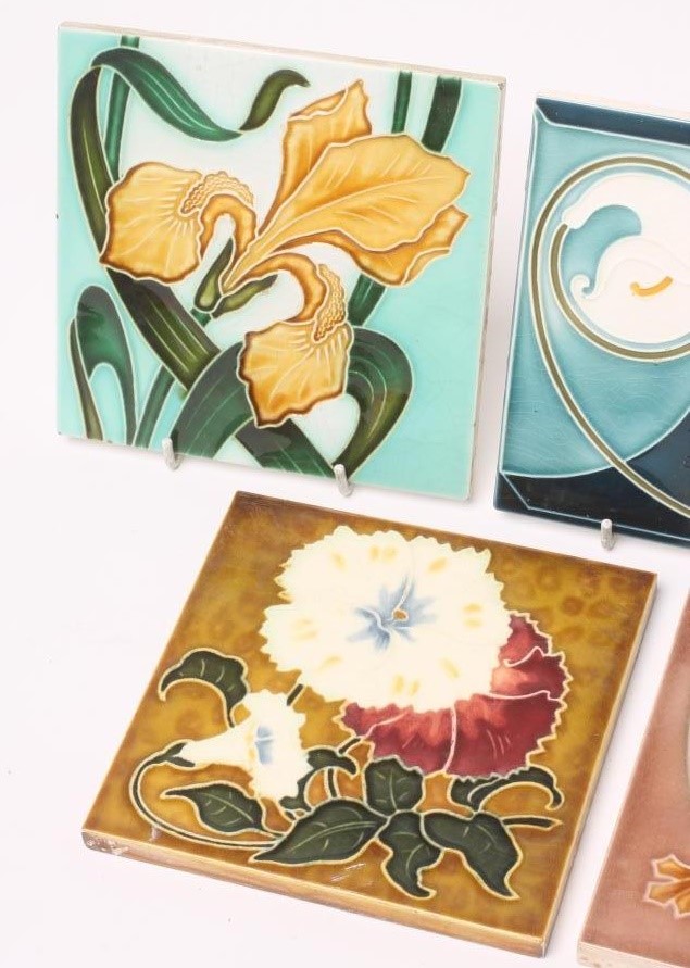 A COLLECTION OF FIVE JUGENDSTIL TILES including a Servais Werke Ag Ehrang red and white flower Image