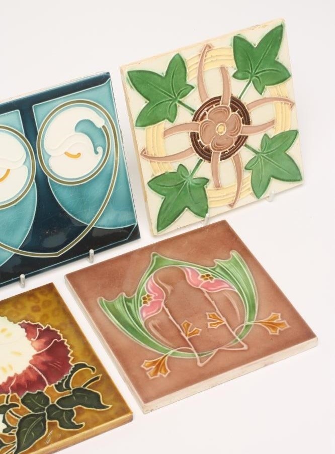 A COLLECTION OF FIVE JUGENDSTIL TILES including a Servais Werke Ag Ehrang red and white flower Image
