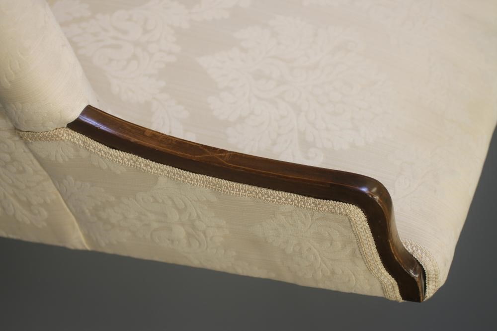 AN EDWARDIAN MAHOGANY FRAMED SOFA of high back form with stringing and upholstered in ivory damask Image