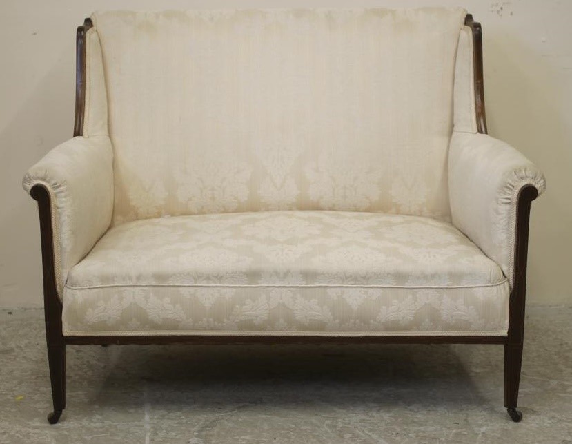 AN EDWARDIAN MAHOGANY FRAMED SOFA of high back form with stringing and upholstered in ivory damask Image