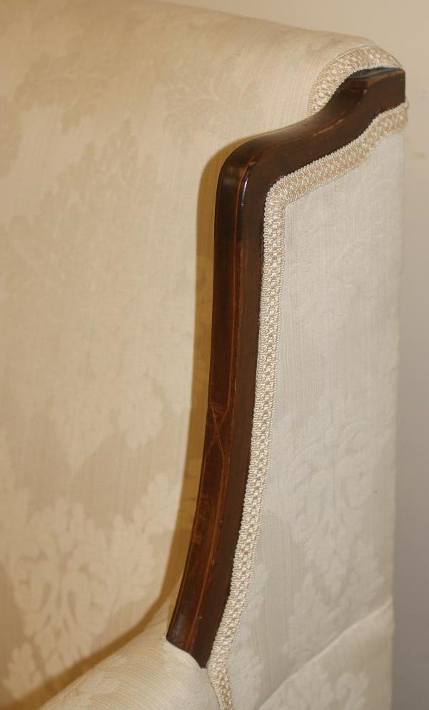 AN EDWARDIAN MAHOGANY FRAMED SOFA of high back form with stringing and upholstered in ivory damask Image