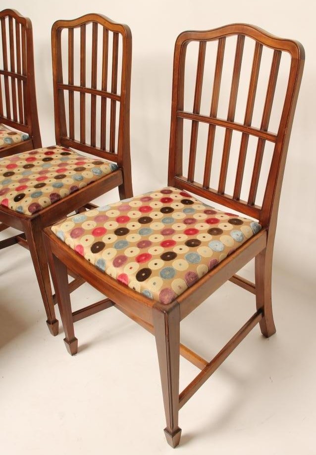 A SET OF SIX MAHOGANY DINING CHAIRS including two elbow chairs Image