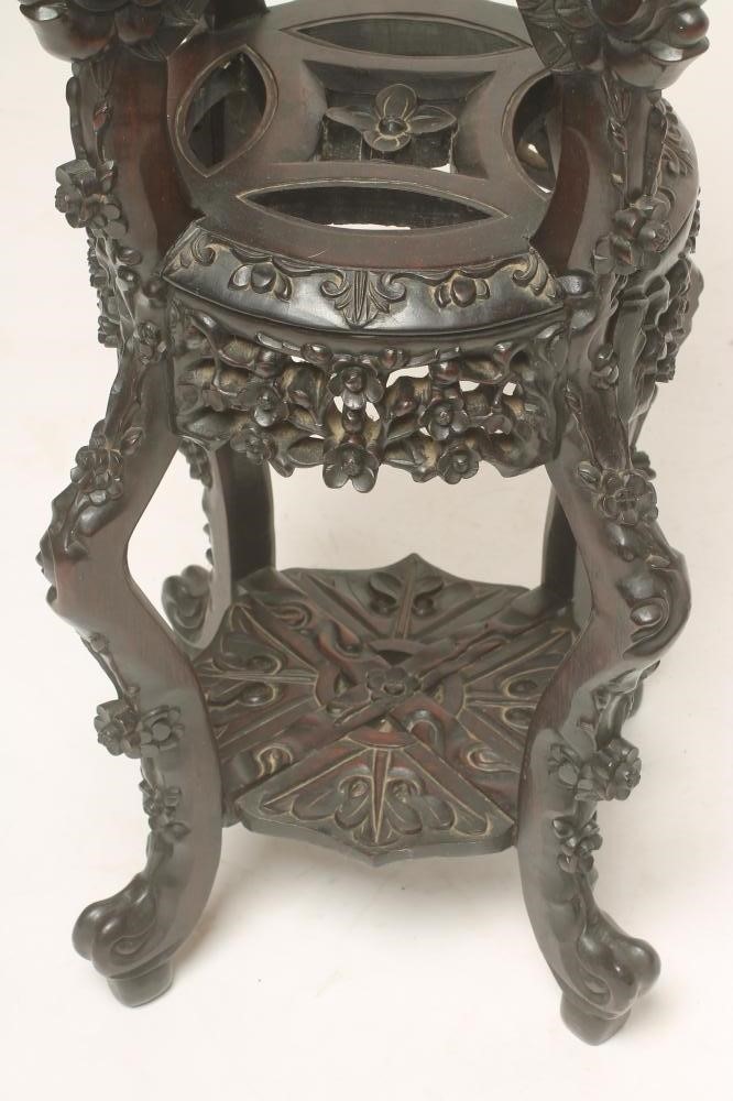 A CHINESE PADOUK WOOD JARDINIERE STAND Image