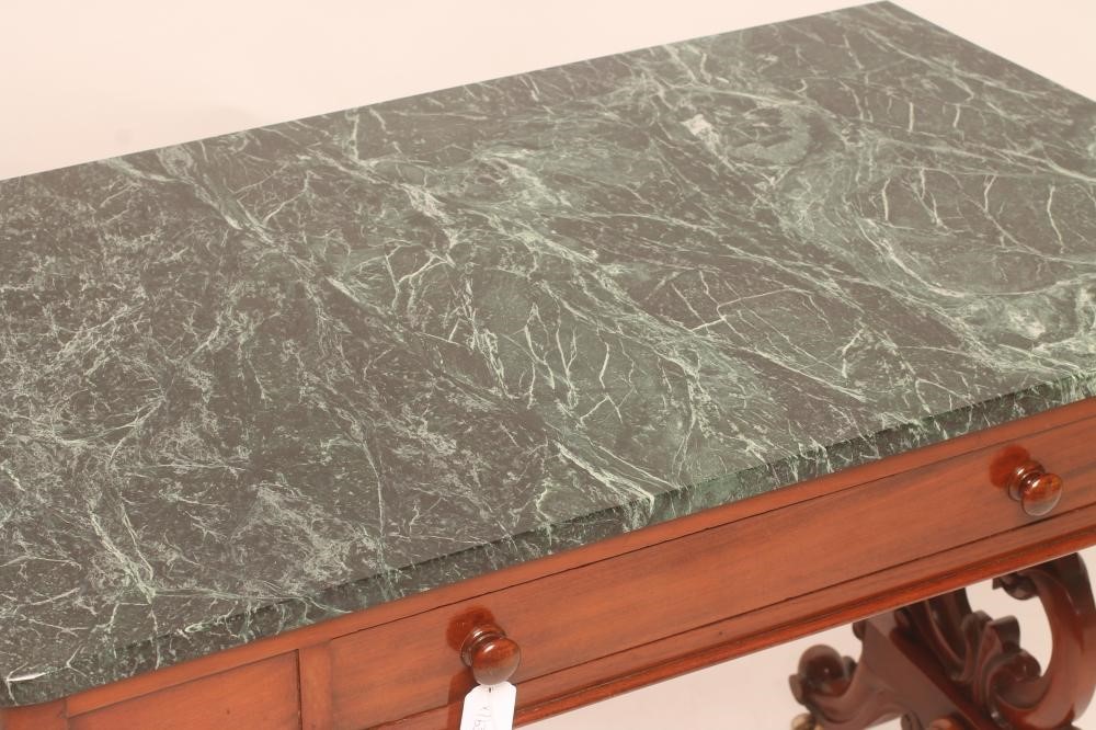 A VICTORIAN MAHOGANY SIDE TABLE of shaped oblong form with green marble top Image