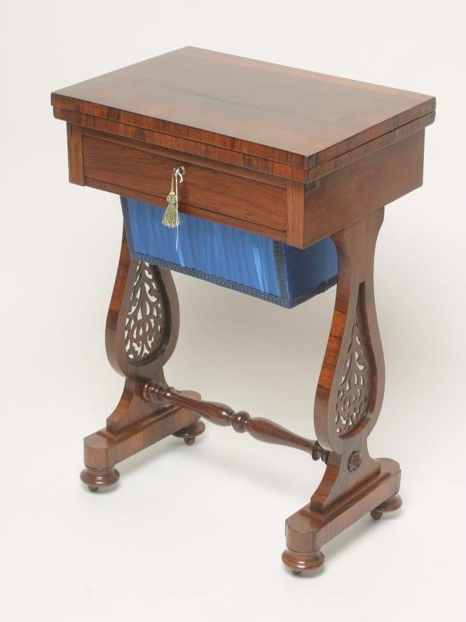 A VICTORIAN ROSEWOOD WORK/GAMES TABLE Image