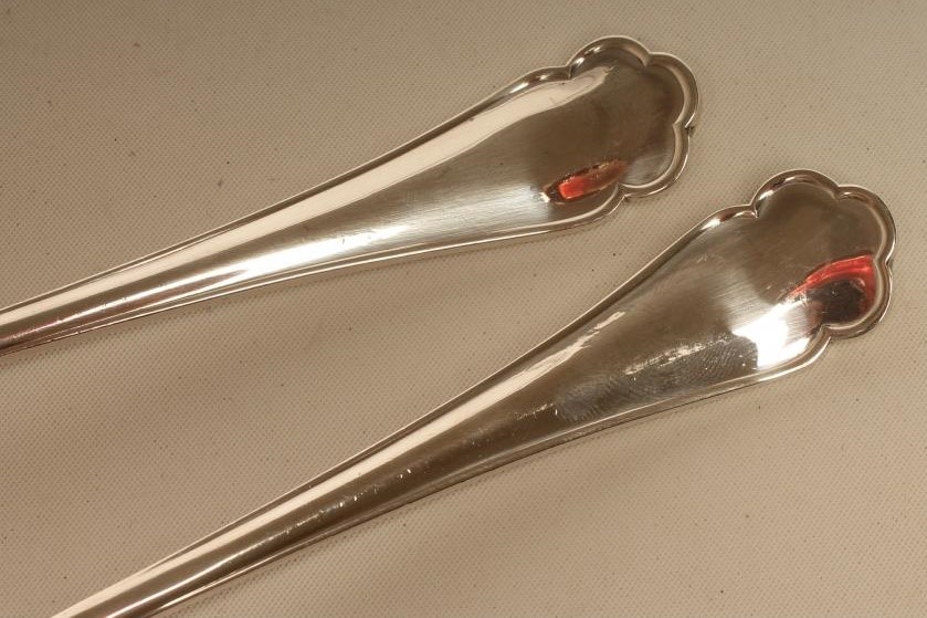 A PAIR OF SILVER SALAD SERVERS Image