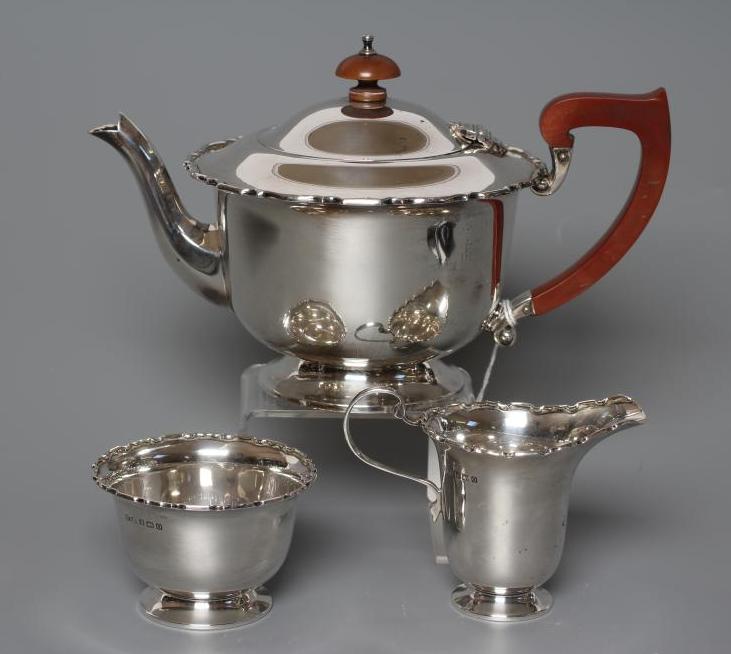 A SILVER THREE PIECE TEA SERVICE Image