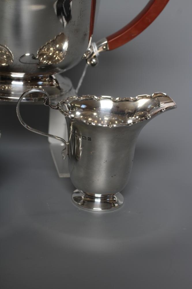 A SILVER THREE PIECE TEA SERVICE Image