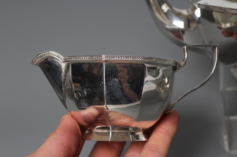 A SILVER THREE PIECE TEA SERVICE Image