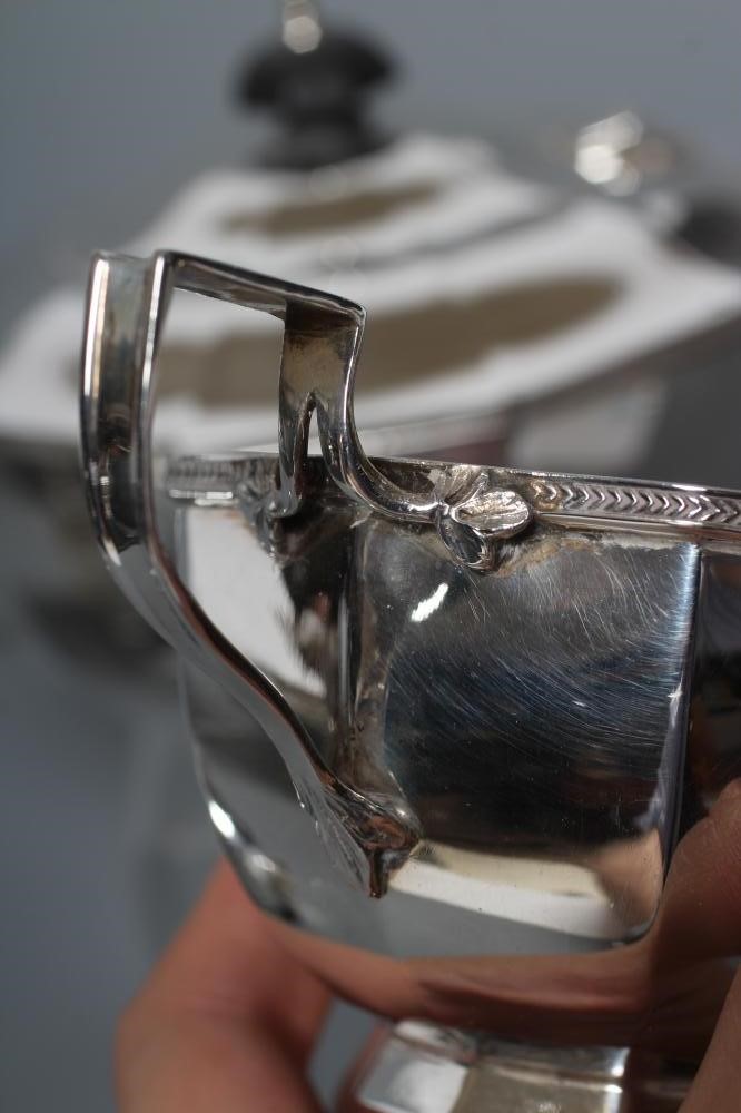 A SILVER THREE PIECE TEA SERVICE Image