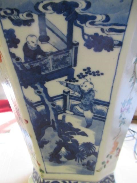 A CHINESE PORCELAIN VASE of swept octagonal form with two scrolling handles Image