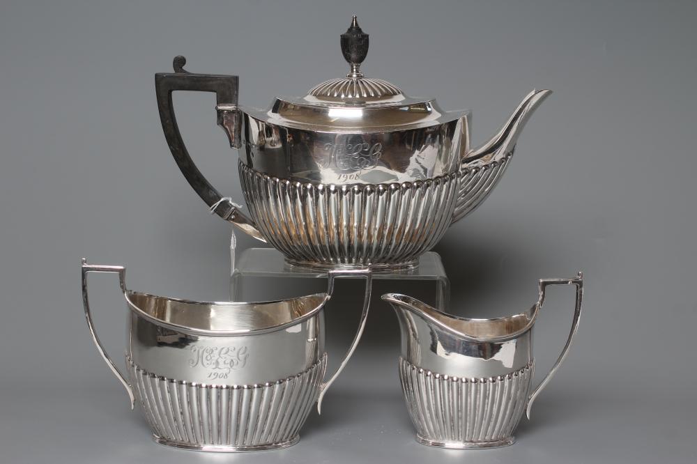 AN EDWARDIAN SILVER COMPOSITE THREE PIECE TEA SERVICE Image