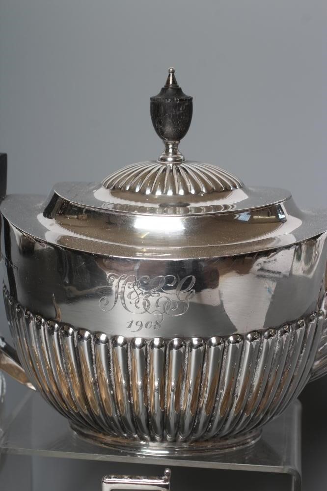 AN EDWARDIAN SILVER COMPOSITE THREE PIECE TEA SERVICE Image