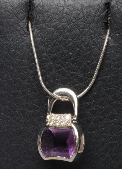 AN AMETHYST AND DIAMOND HANDBAG PENDANT Image