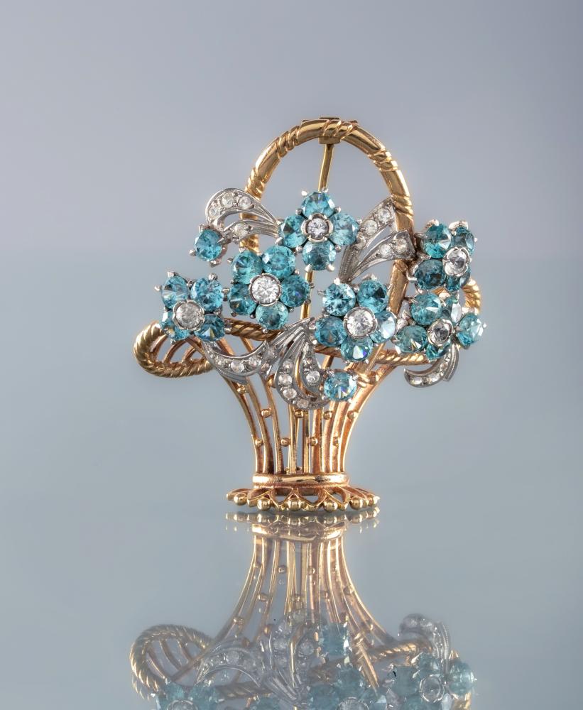 A TOPAZ AND DIAMOND FLOWER BASKET BROOCH Image