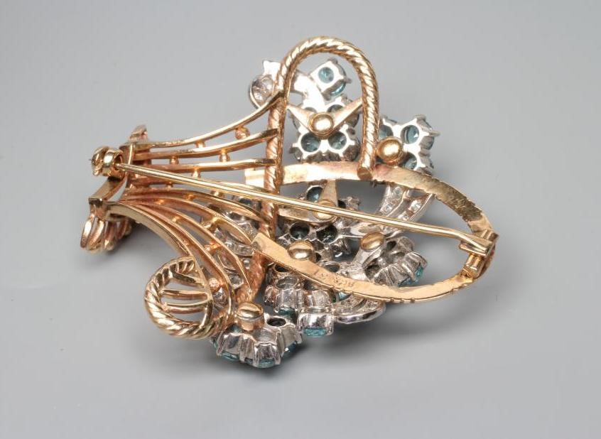 A TOPAZ AND DIAMOND FLOWER BASKET BROOCH Image