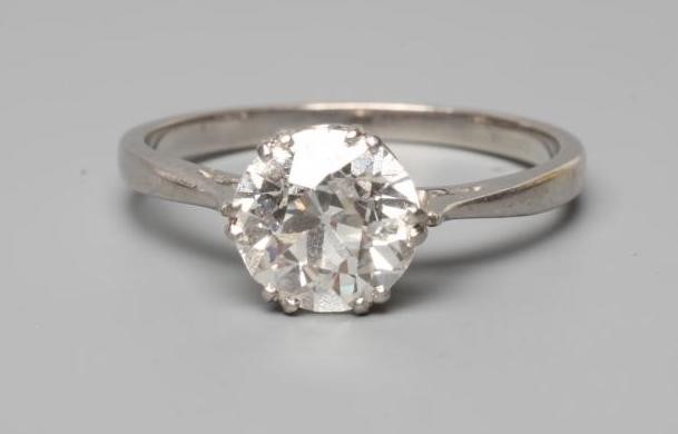 A SOLITAIRE DIAMOND RING, the brilliant cut stone of approximately 1.50cts claw set to a plain, Image