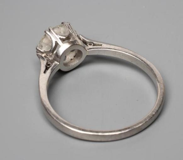 A SOLITAIRE DIAMOND RING, the brilliant cut stone of approximately 1.50cts claw set to a plain, Image