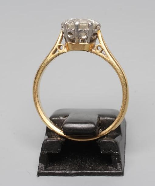 A SOLITAIRE DIAMOND RING, the round brilliant cut stone of approximately 1ct, claw set to a plain Image