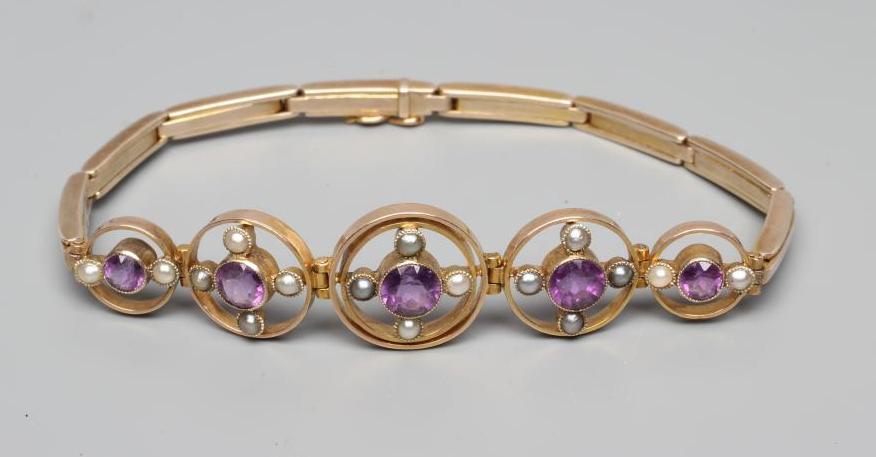 AN EDWARDIAN AMETHYST AND SEED PEARL BRACELET Image